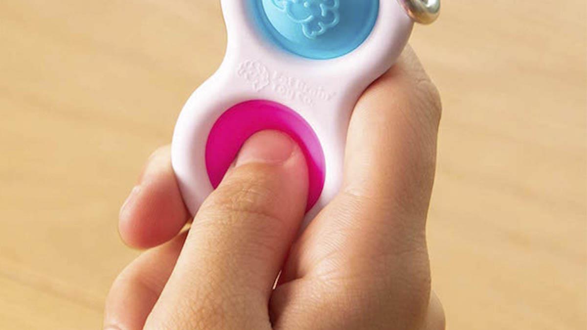 Тактильний антистрес-брелок Кнопки Fat Brain Toys Simpl Dimpl 4 кольори в асорт.  (F2111ML)